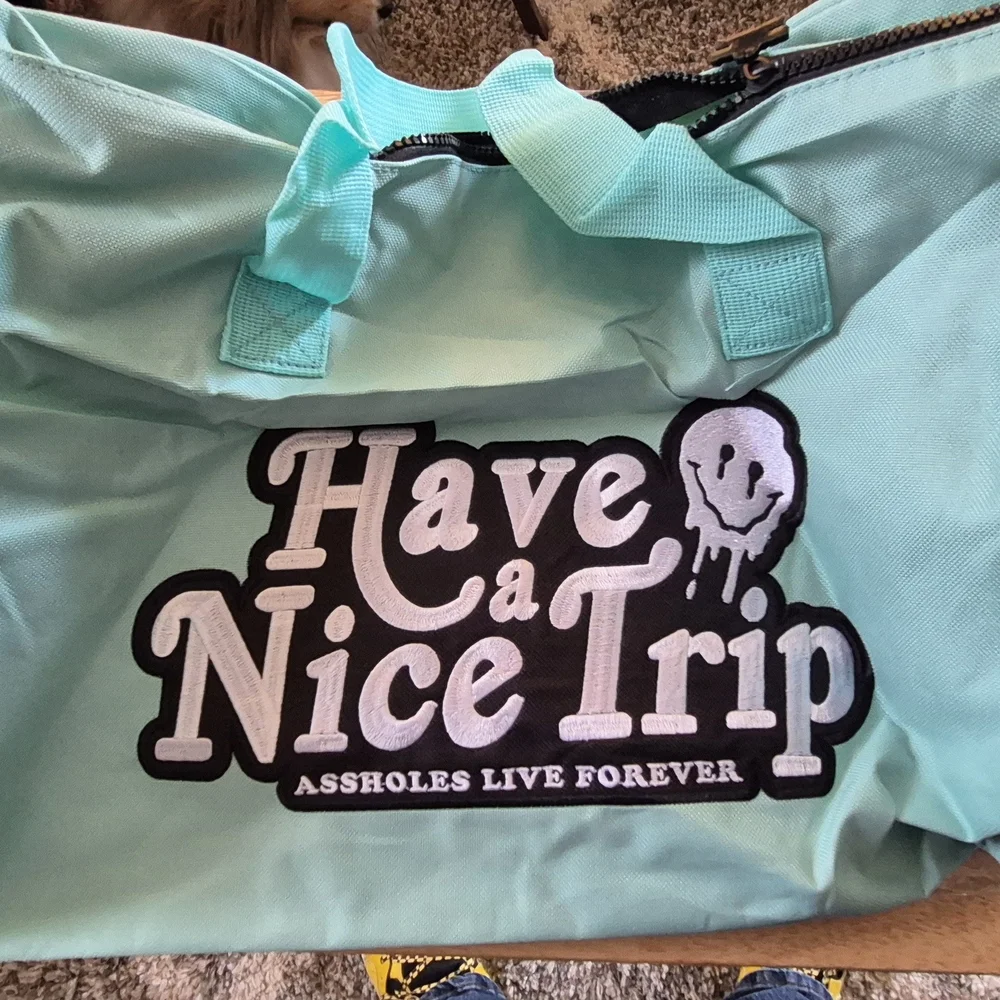 Aqua Garment Bag with 'Assholes Live Forever' Embroidery